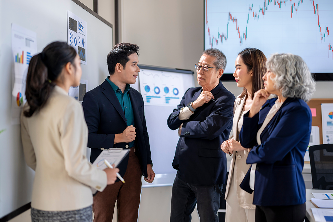 Executive meeting discussing logistics cost reduction strategies