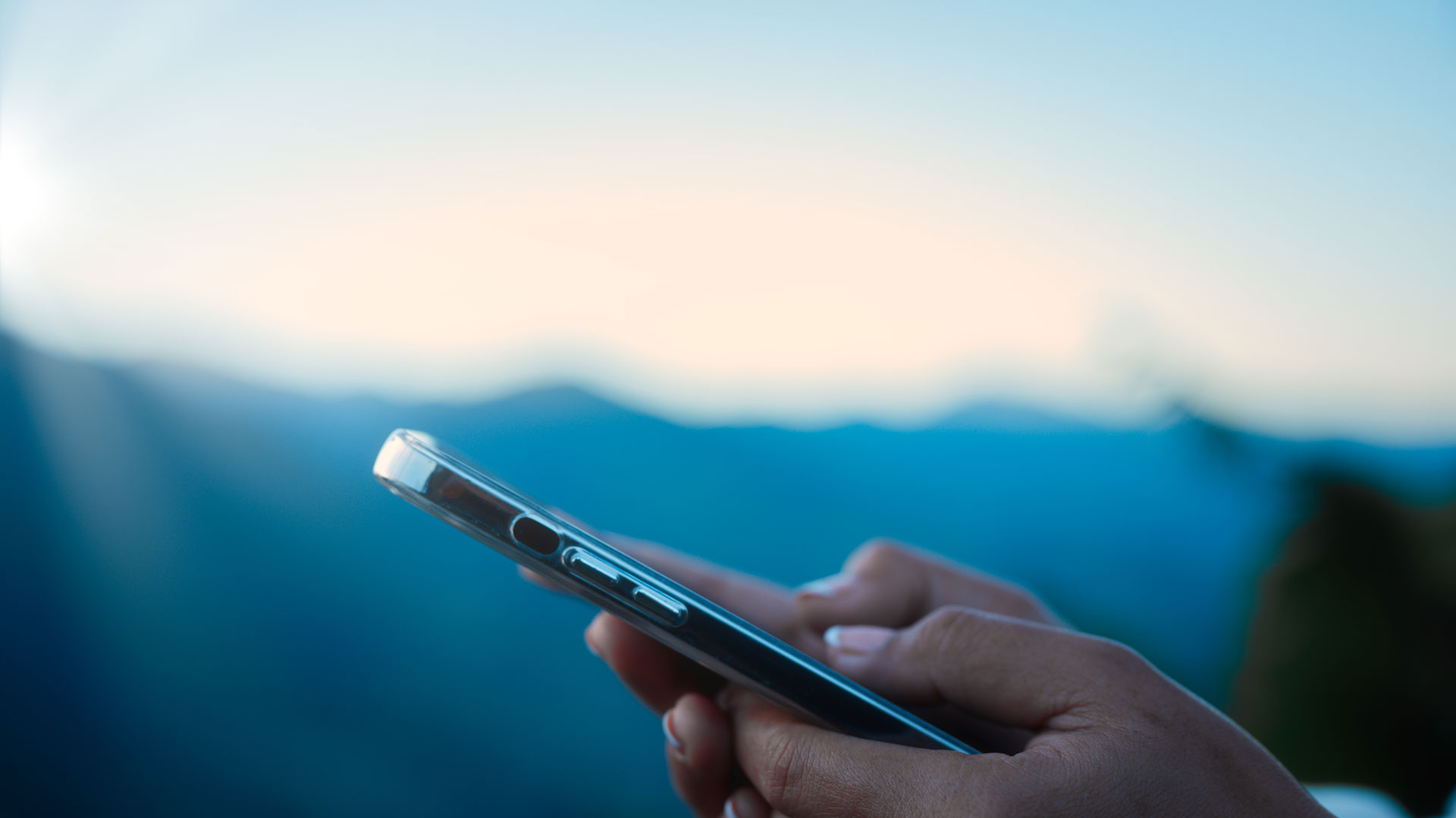 Company leader using a mobile dashboard, leveraging Blue Calmac Group’s Market Sector Report for data-driven insights in the mobile device industry.